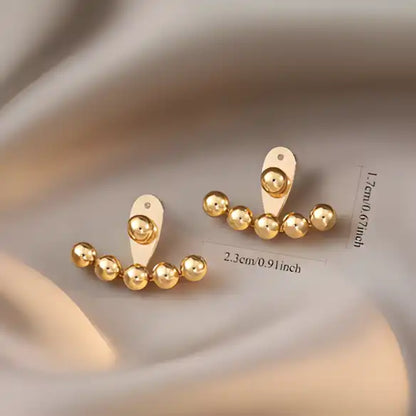 Aretes de bolitas doradas